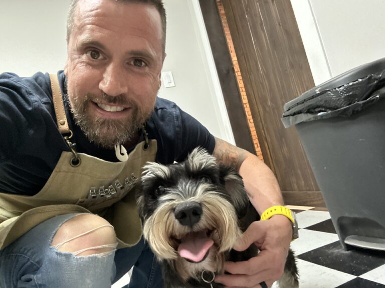 The Faithful Barber & Co barbershop owner with his dog. Barber in Aylmer Ontario.